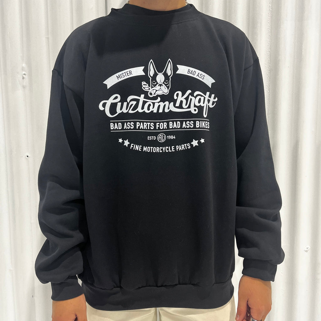 A man wearing a high-quality black 'Signature' Pullover Sweater by Cuztom Kraft.