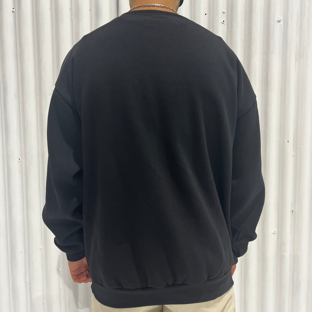The back of a man wearing a 'Signature' Pullover Sweater by Cuztom Kraft.