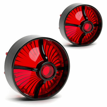 A pair of red and black Cuztom Kraft Harley Davidson Screw in Lenses - Big Turbine / Black / Red on a white background, giving a bold and striking look reminiscent of the Heritage models.